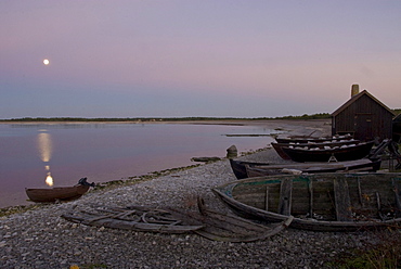 Wooden hut and boats on the beach, Faro, North coast, Gotland, Sweden, Scandinavia, Europe