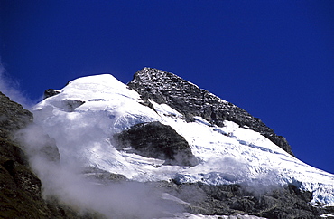 Glacier, snow covered mountain top under blue sky, Mount Aspiring National Park, South Island, New Zealand, Oceania