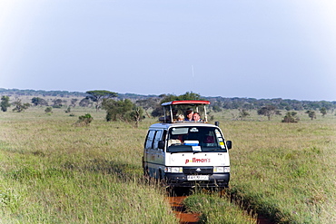 Safari bus on the way in Taita Hills Game Reserve, Coast, Kenya