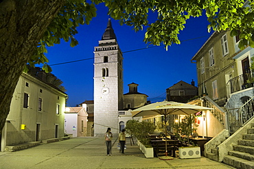 A couple strolling over the market place in the evening, Omisalj, Krk Island, Istria, Croatia, Europe