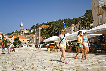 People strolling through the Old Town of Hvar in the sunlight, Hvar Island, Dalmatia, Croatia, Europe