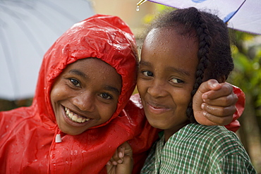 Happy children in the rain, Ambodifototra, Nosy St. Marie, Madagascar, Africa