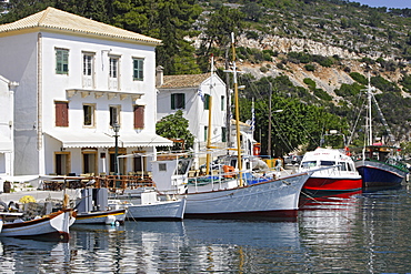 Boats moored in Gaios harbour in the sunlight, Ionian Islands, Paxos, Greece