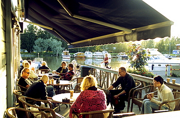 People sitting in a cafe on the waterfront, Porvoo, Finland, Europe