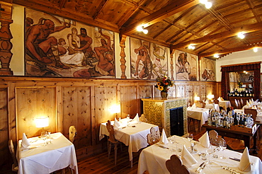 Tables are laid at the dining area of Hotel Zirmerhof, Radein, South Tyrol, Italy, Europe