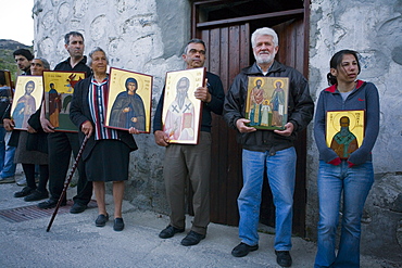 People holding icons at a procession, Orthodox icon procession, Agros, Troodos mountains, South Cyprus, Cyprus