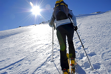 Woman ascending the mountain, ski tour, South Tyrol, Italy