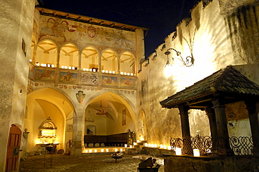 The illuminated atrium of castle Proesels at night, Voels am Schlern, South Tyrol, Italy, Europe