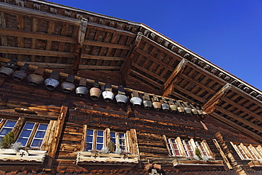 Row of cow bells, mountain restaurant Aebi, Adelboden, Bernese Oberland, Canton of Berne, Switzerland