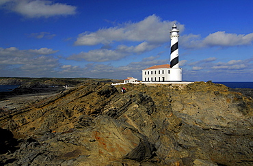 Lighthouse and rocky coast at Cap de Favaritx, Minorca, Balearic Islands, Spain