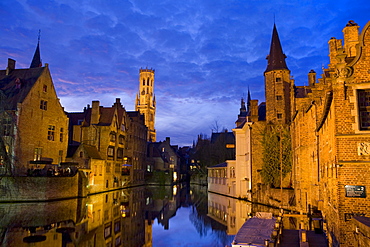 Huidenvettersplein and reflection in the canal, Bruges, Belgium