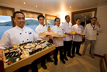 Waiters presenting sushi on board of ship, Shetland, Scotland, Great Britain