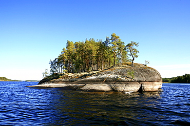 Private island on lake Saimaa under blue sky, Saimaa Lake District, Finland, Europe