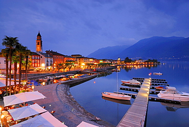 Harbour with boats and illuminated seaside promenade in Ascona, Ascona, lake Maggiore, Lago Maggiore, Ticino, Switzerland