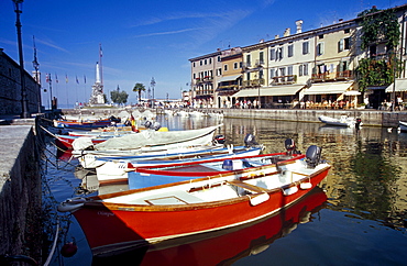 Fishing boats at harbour in the sunlight, Lazise, Lake Garda, Veneto, Italy, Europe