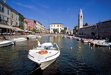 Motor boats at harbour under blue sky, Lazise, Lake Garda, Veneto, Italy, Europe