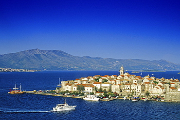 Viewat the Old Town and the harbour of Korcula under blue sky, Korcula island, Croatian Adriatic Sea, Dalmatia, Croatia, Europe