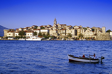 Fishing boat at the harbour of Korcula under blue sky, Korcula island, Croatian Adriatic Sea, Dalmatia, Croatia, Europe