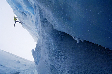 Man ice climbing at a glacier, Tyrol, Austria, Europe