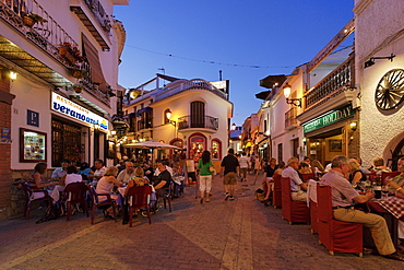 Guests in restaurants in Old Town in the evening, Nerja, Andalusia, Spain