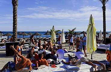 Vacationers in Buddha Beach Club, Puerto Banus, Marbella, Andalusia, Spain