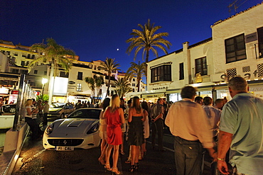 Party guests at harbour, Puerto Banus, Marbella, Andalusia, Spain