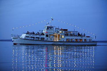 Ferryboat on Lake Chiemsee in the evening, Fraueninsel, Chiemgau, Bavaria, Germany