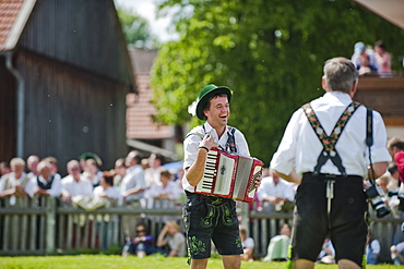 Accordionist wearing traditional costume, May Running, Antdorf, Upper Bavaria, Germany