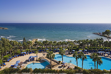 Swimming Pool surrounded by palm trees, Hotel Hawai, Limassol, Cyprus