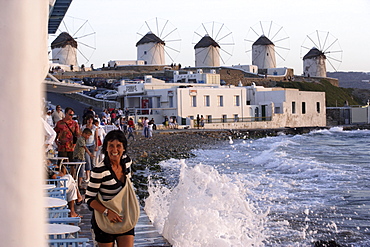 People on the terrace of a bar in the evening sun, Little Venice, Mykonos Town, Greece, Europe