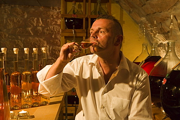 Proprietor Juergen H. Krenzer testing apple sherry in the Apple Wine and Sherry Cellar at Rhoener Schau-Kelterei, Gasthof Zur Krone, Das Rhoenschaf Hotel, Ehrenberg, Seiferts, Rhoen, Hesse, Germany