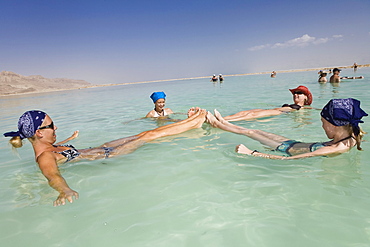 Women and girls floating in the Dead Sea, En Bokek, Israel, Middle East