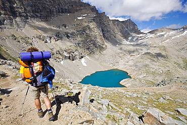 Man hiking near Lago Lillet, Alta Via del Canavese, Gran Paradiso National Park, Piedmont, Italy