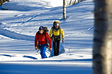Two men hiking through snow, Norway