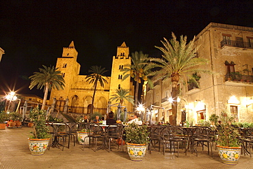 People at a restaurant in front of San Salvatore Cathedral at the square Piazza Duomo at night, Cefalu, Province Palermo, Sicily, Italy, Europe