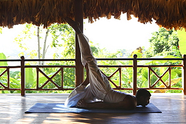 Indian yogi and yoga teacher at the Barefoot at Havelock Resort with a view across the rainforest, Radha Nagar Beach, Beach 7, Havelock Island, Andamans, India