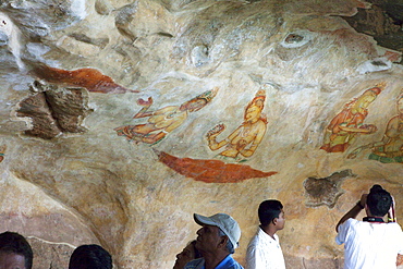 Tourists looking at the mural paintings of the Sigiriya ladies, Sigiriya, Sri Lanka, Asia