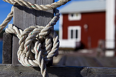 A rope with a knot around a post at Norrfaellsviken, Hoega Kusten, Sweden., Sweden, Europe