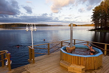 People at eco spa at lake of Trehoerningsjoe, Vaesternorrland, Sweden, Europe