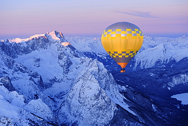 Aerial view of hot-air balloon flying above Zugspitze and Waxensteine, Garmisch-Partenkirchen, Wetterstein range, Bavarian alps, Upper Bavaria, Bavaria, Germany, Europe