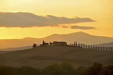 Villa on hilltop with cypresses at sunset, Orcia Valley, Tuscany, Italy, Europe