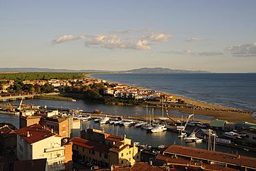 View over harbour and coastline in the evening sun, Castiglione della Pescaia, Maremma, Province Grosseto, Toskana, Italy, Europe