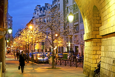 People and illuminated trees at the Viaduc des Arts, Paris, France, Europe