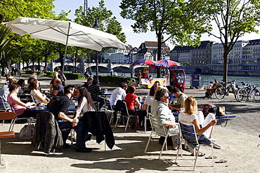 People at a cafe along the banks of the River Rhine, Riviera Klein-Basel, Basel, Switzerland