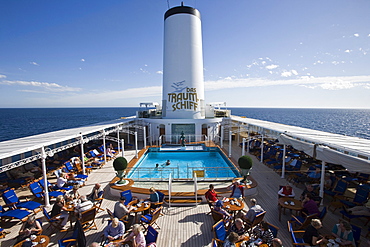 Passengers enjoying coffee and cake on pool deck aboard cruiseship MS Deutschland (Deilmann Cruises), South Atlantic Ocean, South America, America