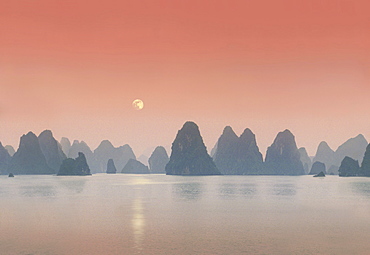 Coastline with limestone formation in the afterglow, Halong Bay, Vietnam, Indochina, Asia