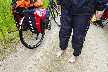 Wet cyclist, Isar Cycle Route, near Moosburg, Upper Bavaria, Germany