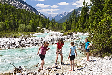 Two women and two girls near Isar riverbank, Hinterau valley, Isar Cycle Route, Karwendel range, Tyrol, Austria