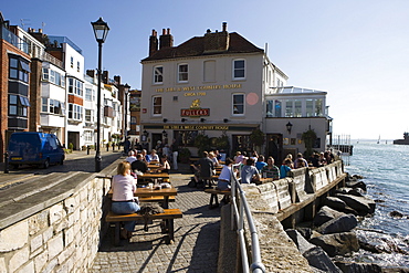 People outside The Still and West Country House Pub in Old Portsmouth, Portsmouth, Hampshire, England, Europe