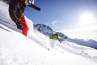 Skiers downhill skiing at Blackcomb Peak, British Columbia, Canada